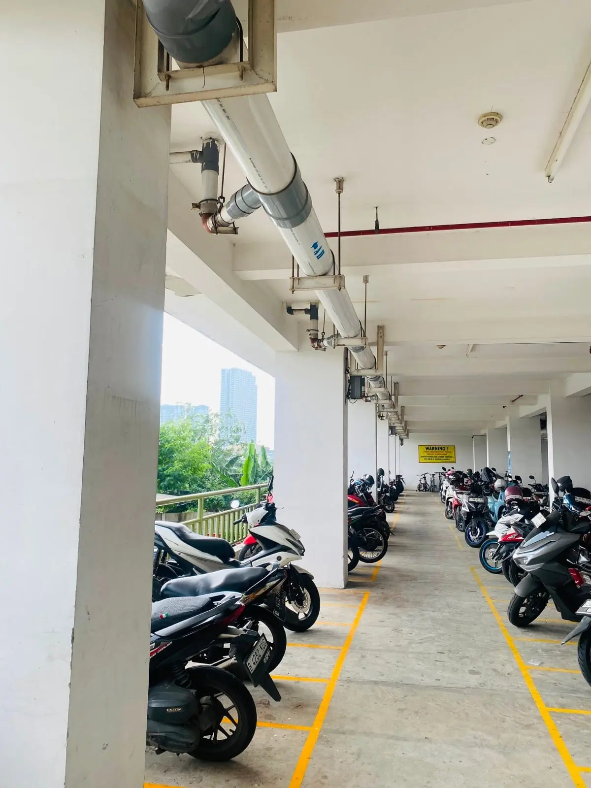 Area parkir motor di apartemen Grand Kamala Lagoon Bekasi.